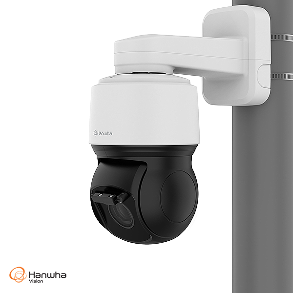 White security camera with black base on a white background, featuring the Hanwha Vision logo.