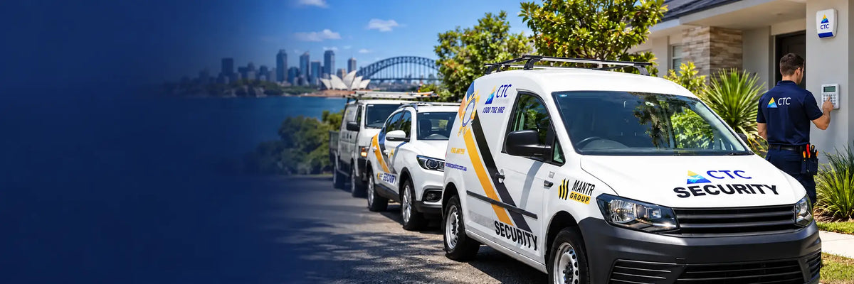 A line of white security vehicles branded with 'CTC SECURITY' parked outside a building, with a uniformed officer standing by the door and a city skyline with a bridge in the background.